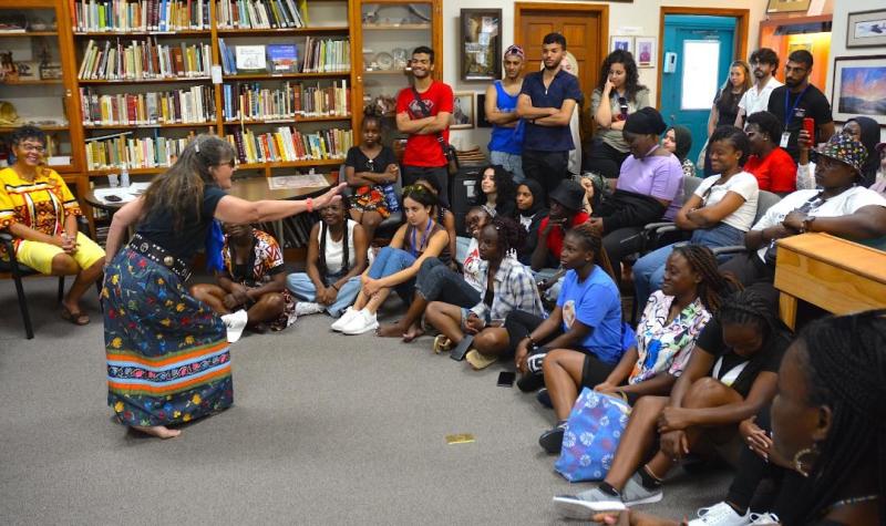 Nanticoke Indian Association member Ragghi Rain tells a traditional Native American story to international students who are in America as part of 2023 programs through the University of Delaware. CHRIS FLOOD PHOTO